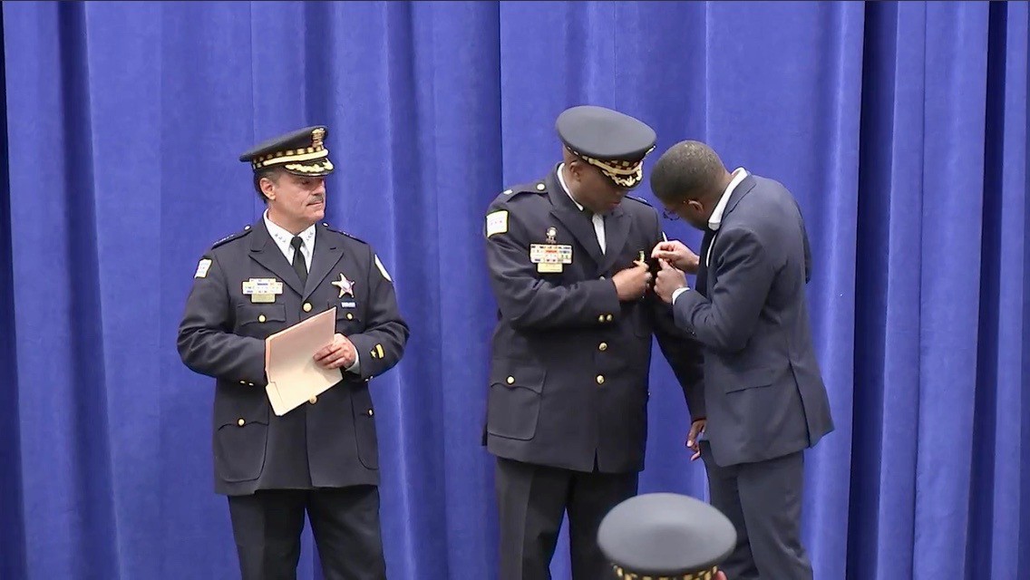 Pinning Dad's star at promotion ceremony