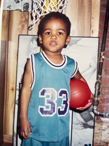Young Khalil with a basketball